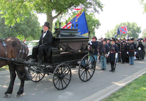 Turners and other Union reenactors behind the hearse.