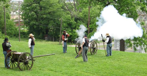 A Company E crew fires the fort's Ordnance rifle in a demonstration at the 2014 living history event at Fort D Historic Site in Cape Girardeau. MO.