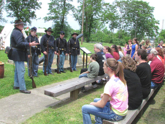 Turner infantry demonstrates the manual of arms for the rifled musket at the 2014 living history event at Fort D Historic Site in Cape Girardeau. MO.