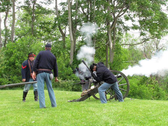 A Company M crew fires its Filley gun in a demonstration at the 2014 living history event at Fort D Historic Site in Cape Girardeau. MO.