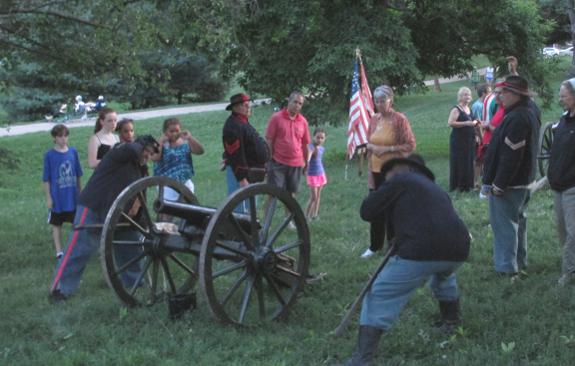 The crew of Company M's Filley gun demonstrates drill during intermission at the Sunday evening Compton Heights band concert at Francis Park in St. Louis, MO.