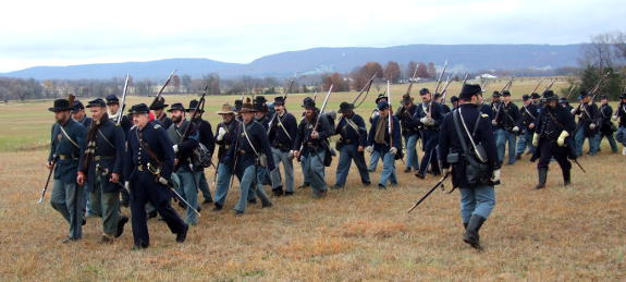 Union infantry of the Frontier Brigade move into position before the action at the reenactment of the Battle of Prairie Grove December 3-4, 2016.