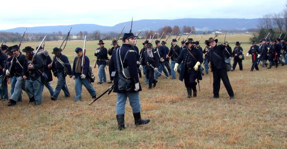 Co. E's Scott House gives directions to a Federal officer as the infantry moves into position at the reenactment of the Battle of Prairie Grove December 3-4, 2016.