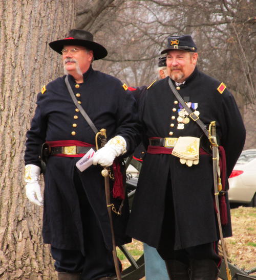 Co. M Capt. Steve Allen and 1Lt. Mike McCubbins observe the proceedings at the Sherman Day ceremony at Calvary Cemetery in St. Louis, MO, February 28, 2016.